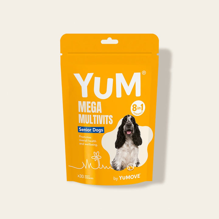 Yellow stand-up pouch of YUM Mega Multivits for senior dogs on a light beige background